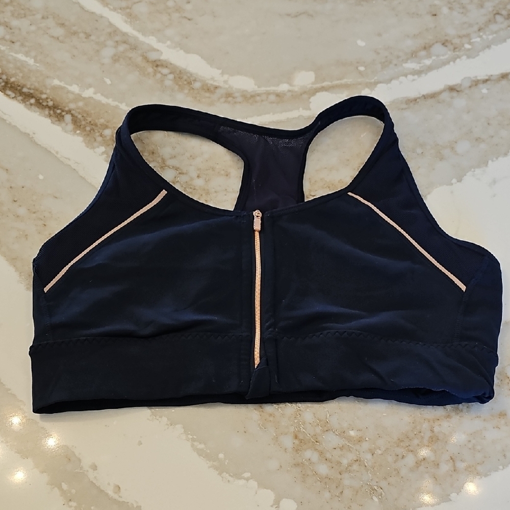 Athleta Women's Navy Sports Bra with Rose Gold Zipper and Accents.